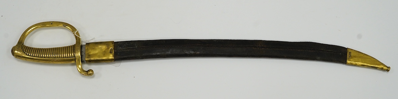 A French briquet cast D-shaped brass hilt in its brass mounted leather scabbard, blade 59.5cm. Condition - fair, blade heavily cleaned